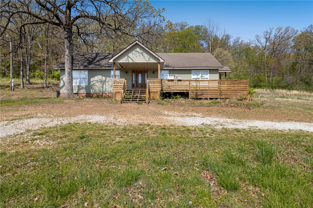 Charming 3-Bedroom home on 3 Acres – Lake Sequoyah Area! Nestled on a peaceful 3-acre lot just minutes from the shores of Lake Sequoyah, this beautifully updated 3-bedroom, 2-bathroom home offers the perfect blend of comfort, nature, and modern convenience. Step inside to a spacious, light-filled interior featuring a fully remodeled kitchen with sleek countertops, updated cabinetry, and modern appliances—perfect for home chefs and entertainers alike. Both bathrooms have been renovated with a third needing some final touches. Enjoy the great outdoors with lake access just moments away, with walking trails and fishing spots. Whether you’re relaxing on the porch with a morning coffee or spending your weekend on the water, this property is ideal for those who crave a lifestyle close to nature. Minutes from the heart of Fayetteville as well!