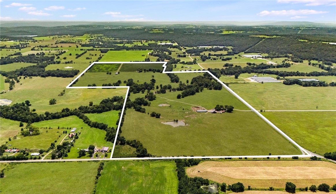 ** 235 Acres of Prime Development Land **
An extraordinary opportunity awaits in this stunning 235 acre property, perfectly positioned right here in NWA's heartland. This expansive property features rolling terrain, scenic views & endless potential.
Developers, picture creating a community w/ numerous 3, 5, 15+ acre parcels for buyers who dream of raising a family, a garden & some farm animals on their very own homestead. A farmhouse barndo, master planned community of likeminded neighbors, if you will.
Gently rolling pastures create a canvas full of lot split opportunities. All encompassing the beauty of two amazing all weather creeks for swimming, playing and refreshing. As well as a large pond for fishing. Current barns & corral systems could also be incorporated into this dream community.
Easy access to major highways, small towns, great schools and all of the amenities NWA has to offer.
Utilities; three natural water wells w/ ample supply, septic and electric.
Don't Miss Out on This One!