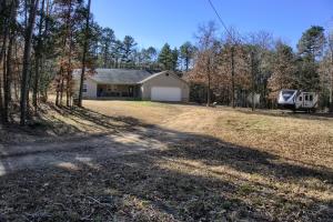 What better way to make 2021 the BEST year ever than in your new HOME! Close to all the town conveniences, but tucked away on your own private 2.5 acres MOL is where you will find this beauty. Loaded with a little over 2100 SF MOL, this HOME features three very spacious bedrooms all with walk in closets, two spacious baths - The master even has a whirlpool tub for soaking away your stress - an open living room, dining room and kitchen that is sure to make anyone super happy. Be sure to check out the tree house out back for all the kids (and adults). Sure to be a fun way to spend your time outside!BONUS: underneath the laminate flooring is stained concrete should you desire that more.