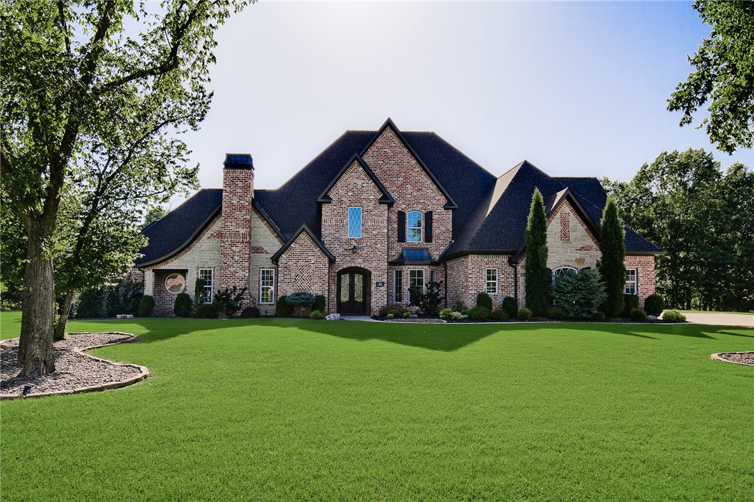Perfectly situated on 3.55 private acres, this 6,700 sq ft masterpiece blends modern luxury with thoughtful design. From the moment you arrive, the stunning architecture, new roof & manicured grounds set the tone for an extraordinary living experience. Inside are 6 bedrooms, 4 full & 2 half bathrooms, offering comfort & privacy for family & guests. The open-concept living spaces are anchored by high-end finishes, soaring ceilings & abundant natural light. A glass-enclosed beverage display adds sophistication to your entertaining space, while the movie theatre promises endless cinematic enjoyment. Functionality meets peace of mind with a built-in storm shelter, dedicated dog run & an impressive detached home gym for private workouts. Every detail is crafted for convenience & lifestyle—whether hosting gatherings, working from home or simply relaxing in your retreat. More than a home, it’s a statement of luxury, privacy & refined living in one of the area’s most sought-after neighborhoods.