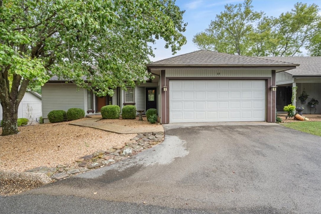 Cozy golf-front townhome featuring 2 bedrooms, 2 baths and 1,210 square feet all on one convenient level. The main bedroom offers a spacious walk-in closet, while the split floor plan provides added privacy. Beautiful luxury vinyl flooring flows throughout the home and features a gas log fireplace. The screened-in porch, overlooking Brittany Golf Course, can be accessed from the main bedroom and the dining room. The home has a two-car garage which currently has enclosed storage in part of the garage making it a usable one and a half car garage.