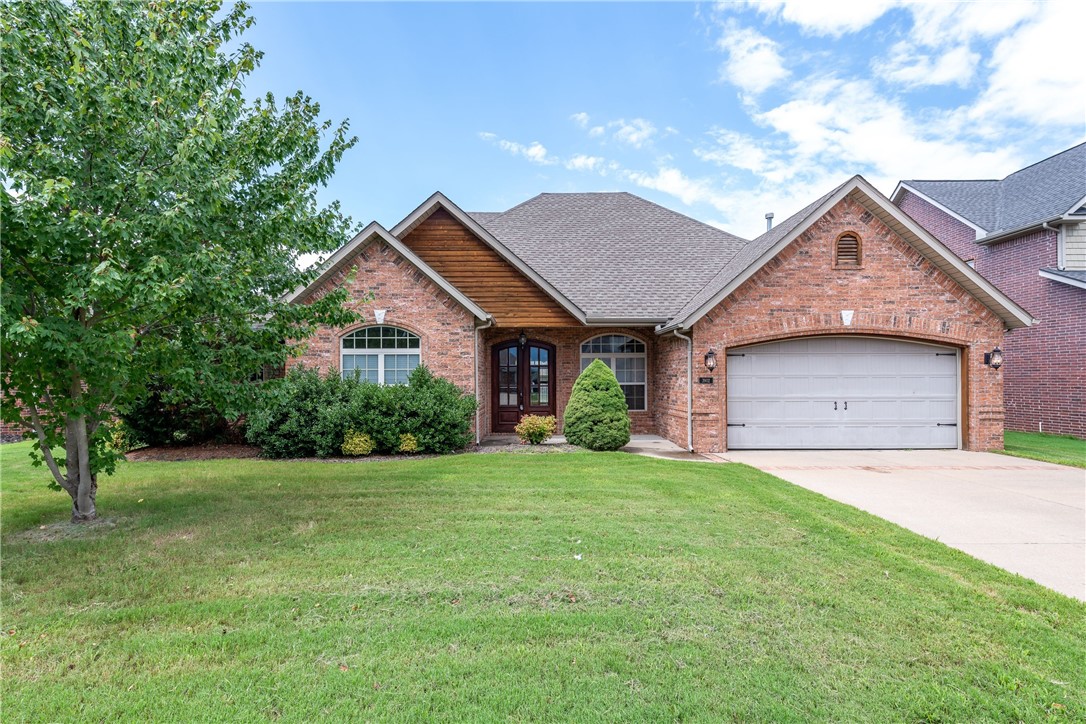 Elegant Bentonville home located in the Oxford subdivision with access to the community pool! Throughout the home you will find rich woodwork, custom cabinetry, and tile flooring - no carpet! Fenced, level lawn and covered patio for outdoor entertaining.