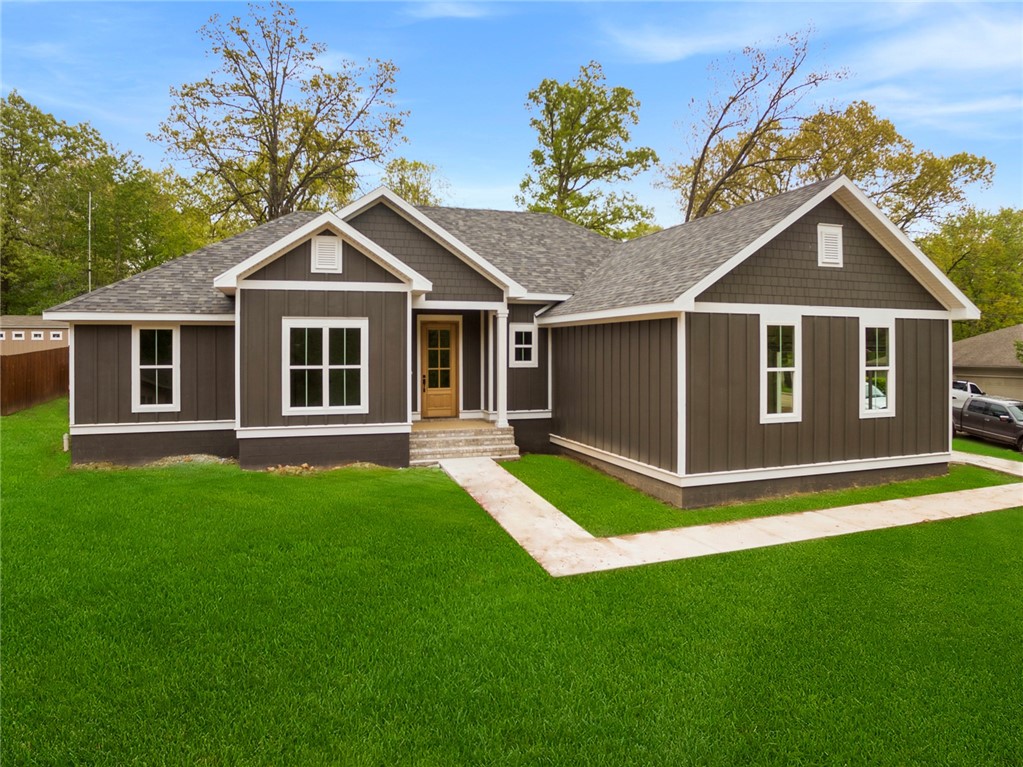 Gorgeous new construction home on level, nearly 1/3 acre corner lot! This stunning open floor-plan features a split design w/ master on one side & 3 bedrooms on the other side of home. Upgraded 3cm quartz counters, beautiful hardwoods & tile work add to the charm of this home! Come home & kick your shoes off in the mud room, w/ the large laundry room nearby that also has access from the master ensuite! A large walk-in pantry off the kitchen allows tons of storage beyond the already well laid out kitchen cabinets w/ soft close doors & drawers. The large covered patio & nearly flat backyard is an ideal space for relaxing or entertaining! This home is only a jump from The Back 40 trailhead which connects to a vast number of trails for recreational opportunities. 15 minutes to the historic Bentonville square and in Copper Elem / Bentonville schools. This home is also on municipal sewer for peace of mind and function. Photos are not of actual home. Fixtures and finishes may vary from photos. Est. Completion 4/15/2021
