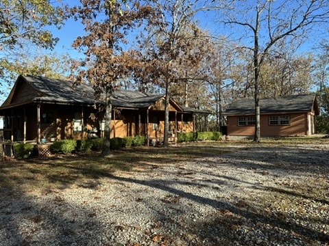 LAKE VIEW HOME Perfect for AIR-BNB This home is steps away from Starkey Marina and Boat Launch, can accommodate one large family or 2 separate families as there is 3 bedrooms and all the same amenities on each floor or which makes it a 2 permanent family home if needed. Large front porch and huge back deck overlooking the lake with beautiful trees. One owner home that has been cared for, in immaculate condition. Beautiful hard wood floors, granite counter tops, large detached garage/workshop, some furniture conveys if needed. Nothing but quality workmanship in this home.