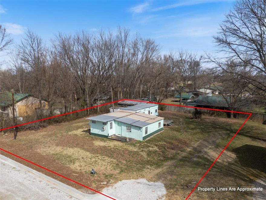 USDA eligible property in the heart of Pea Ridge! This .30-acre residential lot is ideally located just off Main Street, offering convenient access to schools, shopping, dining, and everyday amenities. Zoned residential, the property provides an excellent opportunity for a future homesite or investment. The existing manufactured home conveys with no value given, allowing buyers to focus on the land and its potential. A great opportunity to build or invest in one of Northwest Arkansas’s growing communities.
