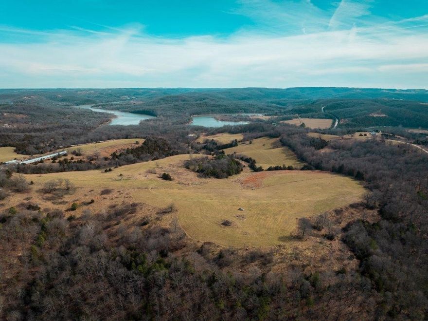 Beautiful acreage! The owner is currently having this land surveyed. About a 1/2 mile from Table Rock Lake. There is a mobile home on the property that we are not giving any value. There is a well, the pump needs to be replaced. The pasture is being rented for hay.