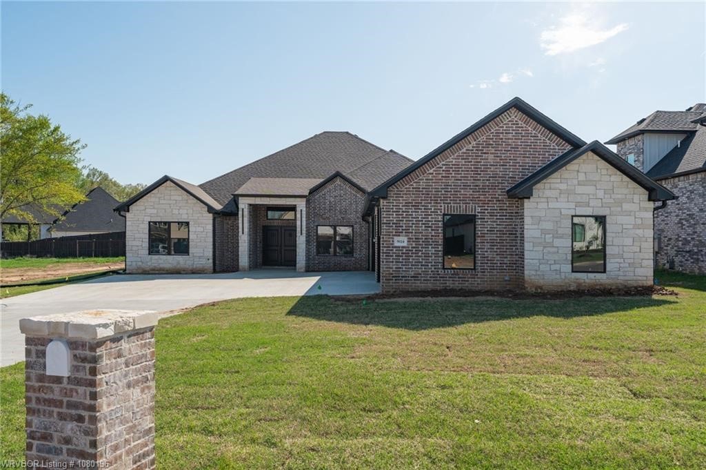 With a striking stone and brick exterior, this luxurious 5-bedroom, 4.5-bath home sits at the end of a quiet cul-de-sac and is certain to be a home you love every day of the week! An open-concept layout with soaring ceilings connects the living and kitchen areas. A large granite island is the centerpiece surrounded by a list of luxury upgrades, including soft-close cabinets, pot filler, 8-burner gas cooktop, built-in refrigerator, deep stainless farmhouse sink, glass rinser and coffee bar. Each bedroom includes a walk-in closet, and multiple bedrooms feature private ensuite baths. The spacious primary suite offers an oversized closet (seriously it's huge!) and a spa-style shower with multiple shower heads. A finished four-seasons sunroom with an outdoor kitchen adds year-round entertaining space. If you need extra space there is a bonus room ideal for a playroom or office, an insert fireplace, and energy-efficient cellulose insulation. Donāt miss the chance to make this exceptional home yours!