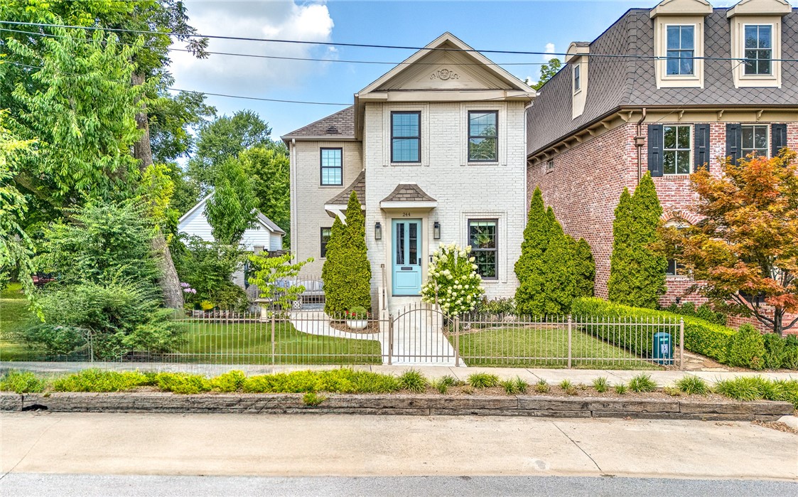 Nestled in the most desirable section of the Bentonville Square, this stunning two-story home blends timeless charm with modern elegance. From the moment you enter, youāre welcomed by a light-filled entry room with expansive windows overlooking a serene side courtyard complete with a soothing fountain. The open-concept featuring a spacious kitchen with quartz countertops, newer CafĆ© appliances, with gas range. Ample storage ensures everything has its place. The oversized family room is anchored by a cozy fireplace and built-in cabinetry, while a built-in desk area offers the perfect spot for productivity. Upstairs, all three bedrooms are thoughtfully placed, including a separate primary wing with custom finishes and a spa-like feel. Large secondary bedrooms boast their own office nook spaces and generous closets. Out back, a private patio and beautifully landscaped breezeway connect to a 2 car garage with alley access. This is more than a homeāitās a rare opportunity
