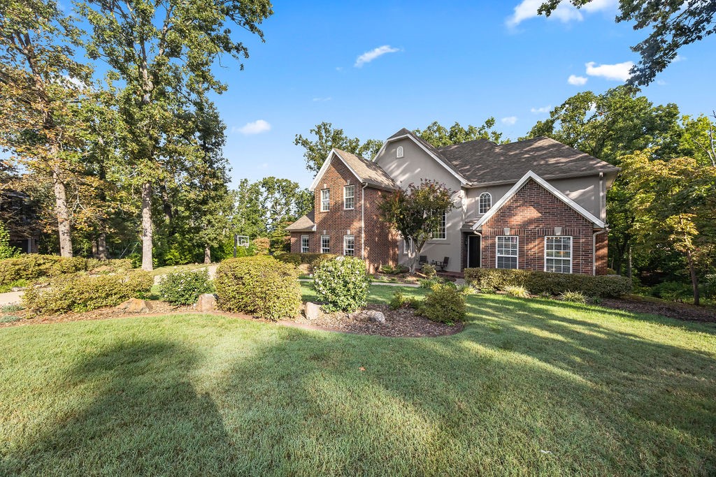 Nearly an acre lot on a quiet cul-de-sac in desirable Stonehenge S/D. This home is move-in ready and built to last. Several high quality updates in 2025 including New Roof with Class 4 Shingles (may qualify for insurance savings!), Gutters, Both HVAC Systems, Air Ducts and Dryer Vent clean out, Interior Paint, New Insulated Garage Doors, and Refreshed/Updated Landscaping. Plus, new Water Heater and Carpet Replaced in 2024. Home consists of 4 bedrooms, 3 1/2 baths, an office or 2nd living area, large gourmet kitchen. Hardwood flooring on main level. Updated master bath. Private deck overlooking the large wooded lot! Unbeatable location just 3 miles from Coler Mountain Bike trail and minutes from Crystal Bridges, Walmart home office and downtown Bentonville. This home offers peaceful suburban living with quick access to Bentonville's best.