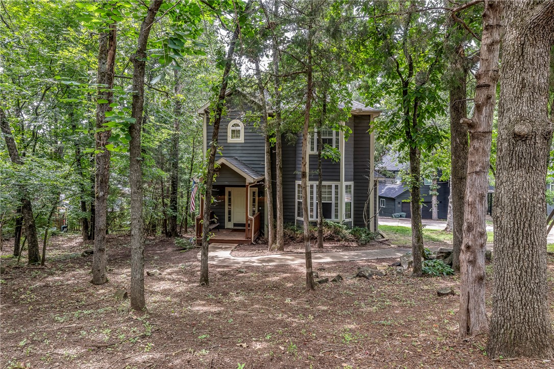 Ever dream of living in a tree house? This is your opportunity!
Located in the popular Huntingdon s/d, nestled among the trees. Back deck looks over Forested yard and common areas. Features include updated lighting, a fireplace surround, a bay window seat, a kitchen has gas cooking, an island has cook book storage, and gorgeous wood flooring throughout the lower level. The half bath is down for convenience. Primary bedroom with ensuite, walk-in closet, two bedrooms with hall bath, and laundry. Attic access through bedrooms. Plantation shutters at every window.