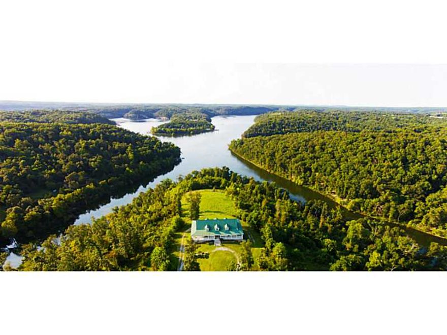 Private & peaceful 75 acre lakefront peninsula w/over engineered 7100 SF custom home (additional 1268 sf unfinished) w/absolutely spectacular views of the lake. Approx 2500 ft of lake frontage w/easy access to the water. 10 minutes from town! Perfect for,large gatherings. Each bedroom w/private bath. Safe rooms. Open spacious floor plan w/multiple living spaces. 1800 SF office - could be guest house. 1500 SF shop. Lakefront trail. Drive leading to waters edge. Geothermal HVAC. Wildlife. 1 year warranty!