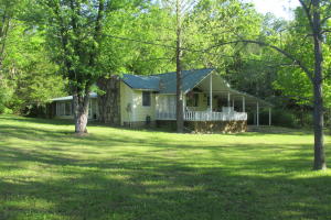 Two B/R, 1 Bath, home sitting on 3.73 l acres and located app. 2 miles west of Harrison with Harrison phone and schools. The home is an older home with nice kitchen and dining area. Fireplace with wood burning insert. Small covered shed. Covered front porch.Deep Well with Rural water near by. Paved frontage on Rock Springs Rd. Home sits in edge of woods and has a nice meadow.