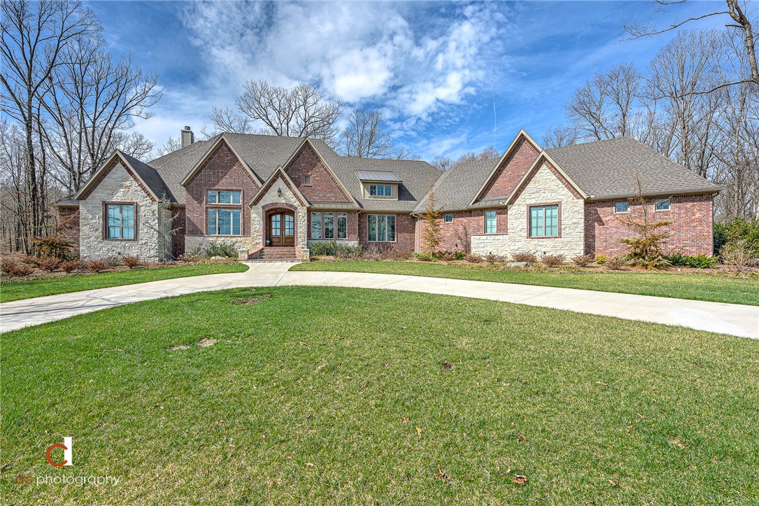 Stunning Home in East Fayetteville on over 8 Acres! Just 25 minutes to Downtown Fayetteville, enjoy secluded living in nature with all the beautiful views that Goshen has to offer. Breathtaking features of this home will greet you as you arrive, including the 18' cathedral ceilings. Immaculate and better than new, no detail has been missed. From oversized walk-in closets, to carefully designed storage and pantries, this home is as custom as it gets! The master suite is incomparable with a brick accent wall, remote window shades, a luxury bathroom, dreamy closet, and exercise room to accommodate every need... and the closet connects to the spacious laundry room with a built in dog kennel. The cedar wrapped screened in porch boasts a 22' vaulted ceiling for year-round relaxation and nature viewing. Epoxy garage flooring, professional landscaping & sprinkler system. Too many details to list- MUST SEE! Bonus: Ozarks go internet allows for a carefree work from home environment in a grand office with 14' ceilings.