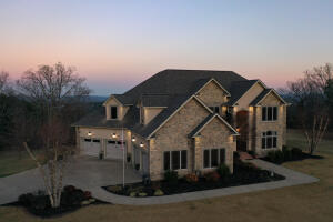 This home is truly made for both entertaining and everyday living, with plenty of space and amazing views. Enjoy an open floor plan, high ceilings and a chef's kitchen with stainless steel appliances, plenty of cabinet space, gas cooktop, double ovens, warming door and beautiful granite countertops. The homes floorpan boasts 5142+/-sf with 5 bedrooms and 5 bathrooms, multiple home office options and an incredible large gaming/entertainment room downstairs with heated floors tied into the dual geo-thermal system for the home. Walk outside to your resort like backyard oasis, an east facing paradise with stretched covered patio, outdoor kitchen, outdoor fireplace and pool area all with captivating mountain views. This property is immaculate, well-cared for, and ready for new owners.