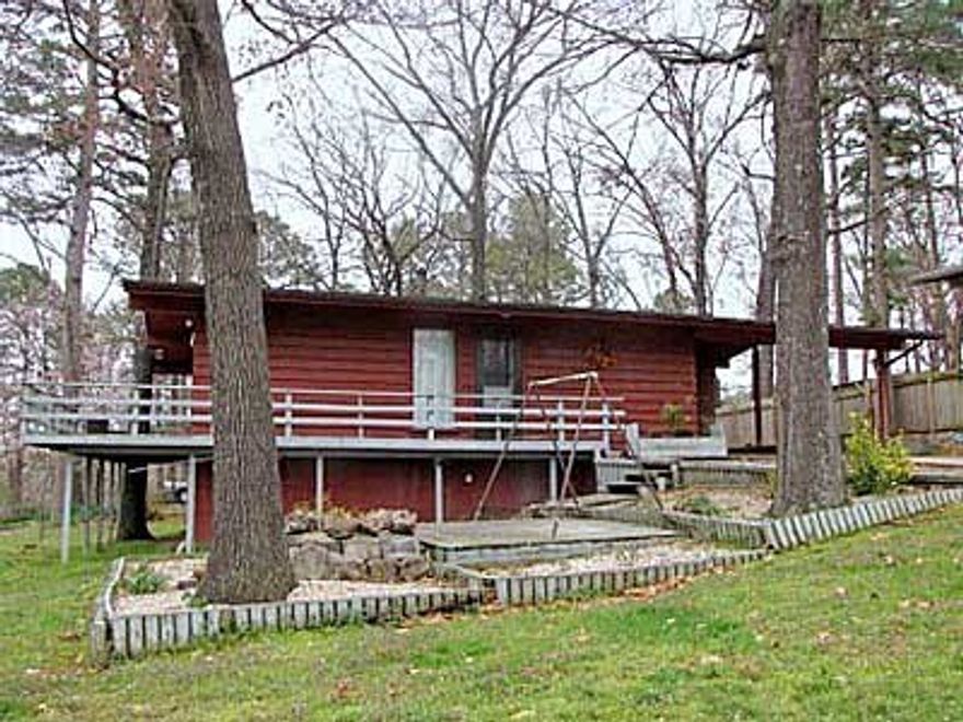 Wall of windows, newer heat and air in this cute 2 bedroom home. Newer flooring and hot water heater. Security system that can be controlled with your smart phone! Lots of beautiful built-in cabinets, buffet and entertainment center. Workshop off of the carport.