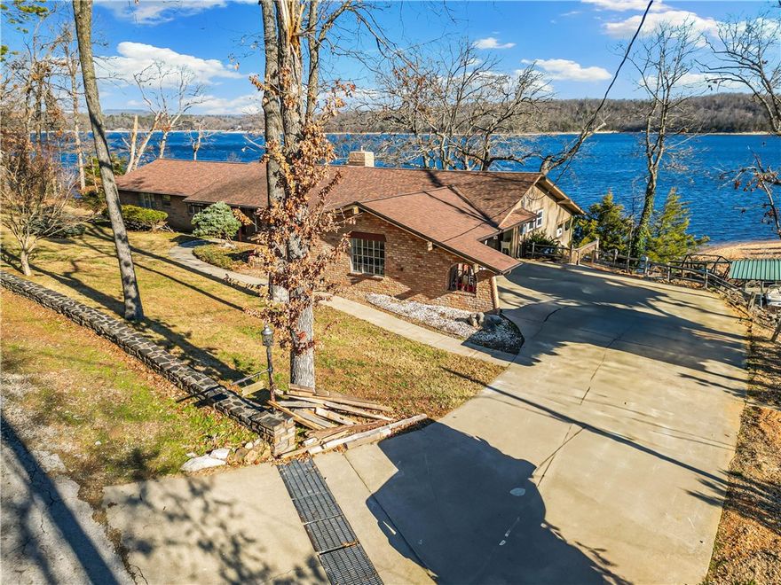 Home with .87 acres, water front, private boat dock with swim deck.