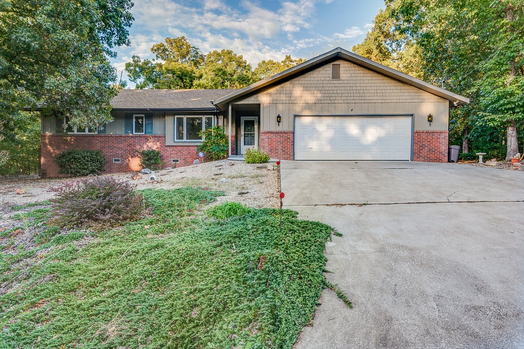 1557 SF w/ 2 living areas, built in desk, gas log fireplace, 2 car garage, screened porch, open deck space, and workshop area! Very well maintained. Newer heat pump, roof, water heater, garbage disposal, and refrigerator! Great location within walking distance to Branchwood with trails behind home.