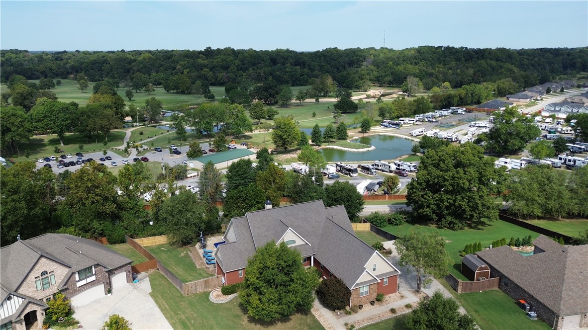 This ONE OF A KIND builder's home includes much more than 4 BR/4 BA, 4 car garage, formal living and dining, huge family room, awesome office, safe room, 4 decks/patios overlooking the Creeks Golf Course, huge workshop with heat and air, and so much more! The pool and veranda overlook the golf course and the pool has a brand new liner. Must see to believe all the extras, all rooms are oversized for a great feel and function. You need to see it to believe all the features found in this home. Make an appointment today. This home won't last long! Agent owned.