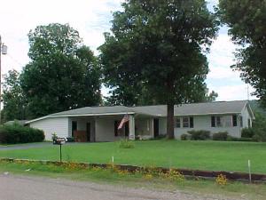 WALK TO SCHOOL OR COUNTRY STORE: This home features 3 bedroom, 1-1/2 bath situated on 5.25 acres, hardwood floors, paved drive, fenced pasture, chain link fenced yard, 8x10 storage building, workshop, beautiful view, lots of storage, large shade tree's and much more.
