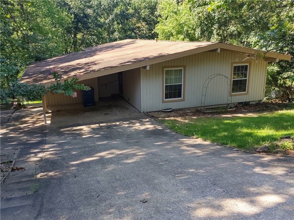 Taking back up offers. Come and get the least expensive home in Bella Vista. House needs some work but has good bones, newer deck, siding is good, part of car pot has been converted to living space. Lots of stuff in house now but will be removed soon. Do not open the fridge, power is off and smells bad in the fridge. HVAC is 9 years old, Septic has been replaced. Unfinished basement could be a workshop or man cave. Sold as-is.