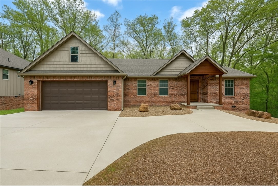 FABULOUS Custom 2x6 home w/9' ceilings & walkout basement. Features dual high-efficiency heat pumps, gas fireplace, engineered hardwood, & laundry rooms w/storage on both floors. Chef’s kitchen includes coffee bar, gas range, granite island, & walk-in pantry. Master suite has spa-style bath, rain shower, freestanding tub, dual vanities, & huge walk-in closet. Basement features bonus space w/ outdoor access, kitchenette- perfect potential for in-law suite or Airbnb. Tons of storage: attic, closets, crawl space. Office/library included. Low-maintenance yard, oversized 2-car garage + extra parking. Double decks offer private, treehouse-like feel, perfect for relaxing, grilling, or birdwatching—outdoor TV and fan included. Located on a quiet street with friendly neighbors. Backs up to the scenic Back 40 trail’s “happy hour loop” & close to Blowing Springs & greenway. Plenty of space to entertain & enjoy all NWA & Bella Vista has to offer. In Bentonville School District.