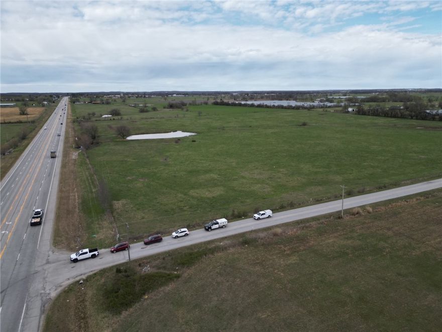 37.5 acres of highway frontage with paved side road. Sold at listing