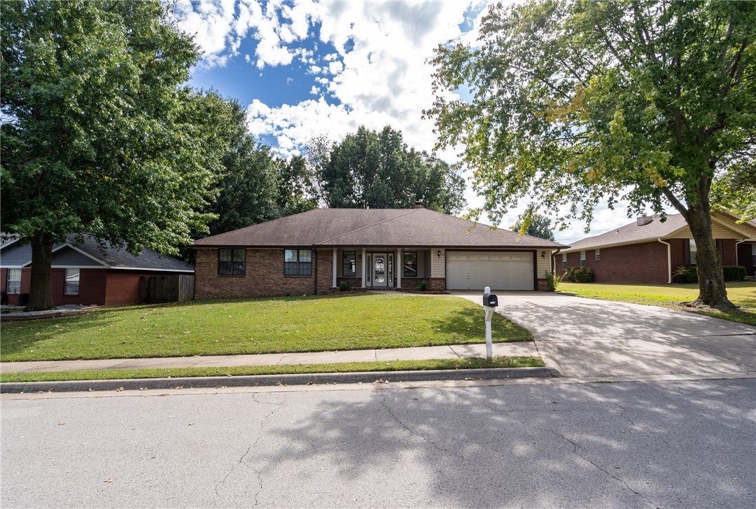 Spacious home on a large lot convient to everything in Springdale! Just minutes from Interstate 49, Tyson Headquarters, Arkansas Childrens Hospital, Arvest Ballpark, Tyson Sports Complex, Harps, Walmart and much more. Located on a quiet well kept street and walking distance to Walker Elementary! A large covered back porch and spacious lot with mature trees is perfect for entertaining! The large bedrooms, walk in closet in the master, and very large living room highlighted by a gas fireplace and plenty of windows make this home comfortable and inviting.