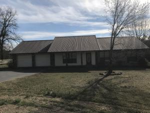 Hwy 10, Danville- A Wonderful Home place, home features 1695 sqft. 3BR, 2BA, Living with vaulted ceiling, 2 car garage, metal roof, covered deck. Home comes with 6+/-acres.