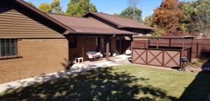Beautiful setting for this 3BR/2.5BA split level home on 4.89 acres on paved road; includes a 48'x28' shop with concrete floor & electric built in 2013; new roof in 2008; H/A in 2009 new windows in 2013 convection oven in 2014 & cook-top in 2014; gas fireplace; Generac generator; storm cellar in garage.