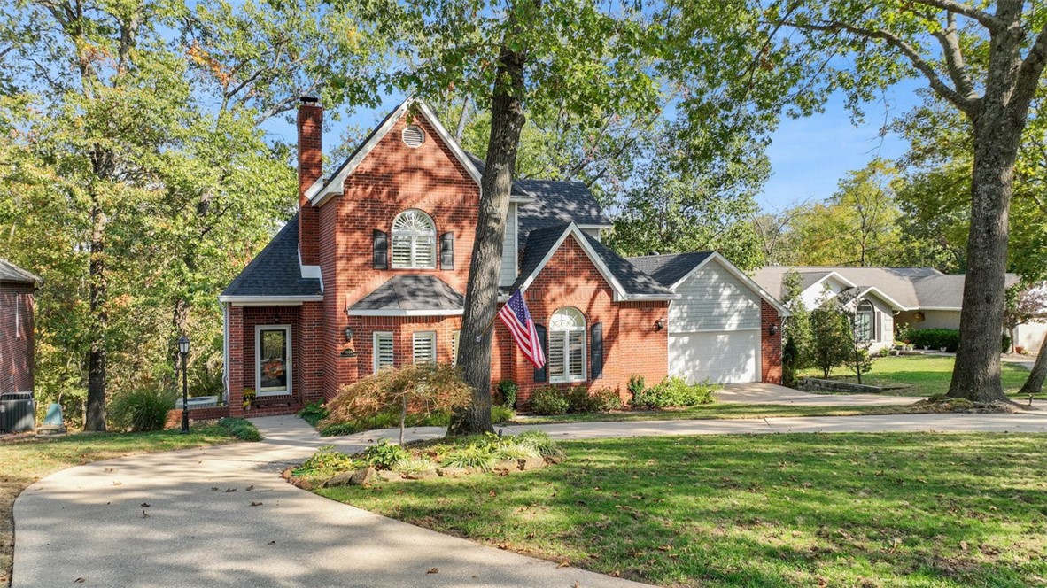 Trailheads, dog parks, Bentonville Square - OH MY! Located in the coveted Hidden Springs subdivision, this charming three story home on .69 acres, is located by the Slaughter Pen Trailhead, Bentonville Dog Park, 2 miles north of the Bentonville Square, with quick access to highway 49. A beautiful blend of comfort & functionality, boasting 3 bedrooms & 3.5 baths, finished walkout basement, a spacious 2,760 sqft Enjoy the beautifully landscaped yards, expansive deck, mature hardwoods, & natural wildlife! The interior showcases a main-level primary bed, bath & laundry. Plenty of room for entertaining in the dining, living room, & kitchen. Upstairs are two additional bedrooms, shared bath & office loft space. Downstairs is perfect for a gameroom, sporting an extended covered patio, sit on your attached swing & enjoy your beautiful multilevel yard, & private wildlife area. The ideal home for families seeking a peaceful yet convenient lifestyle; encompass all that Bentonville Living has to offer.