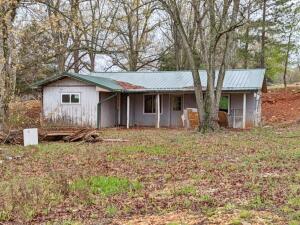 This one's got a ton of potential with much of the work already started including most of the tear out, much new plumbing, electrical, new roof & new windows. Finish this one out the way you would like. All #s are approx, age is estimate, square footage per assessor, buyer to verify existence of septic.