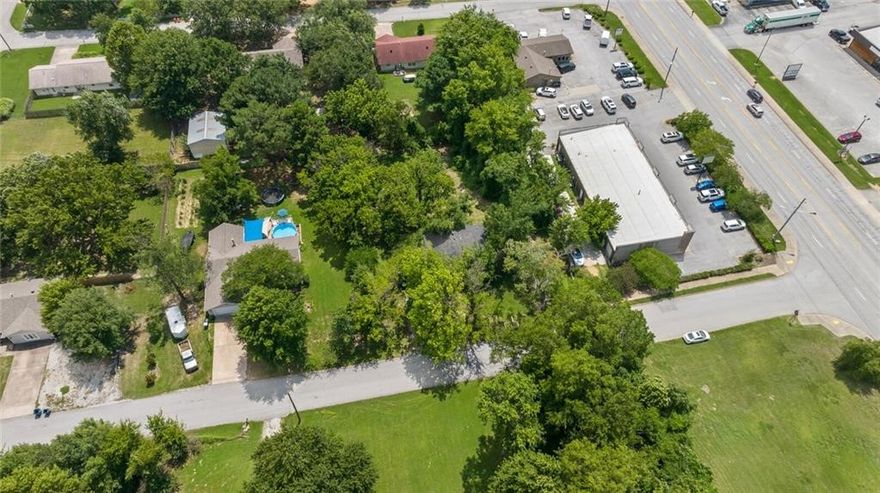 Prime investment opportunity in the heart of Bentonville's Business District. Up to 3 acres could be purchased by combining several surrounding lots and providing development opportunities for multi-family, condos, or townhouses, etc.  High density residential zoning available.  Walking and biking distance to nearby businesses. Near trails. .9 miles from Horsebarn Trailhead. 2.7 miles to Osage Creek Trail. 2.5 miles to Rail Line Trailhead North. 2 Miles to the new Walmart campus. See attachments for regional zoning policy. Also listed as Residential MLS # 1297368
