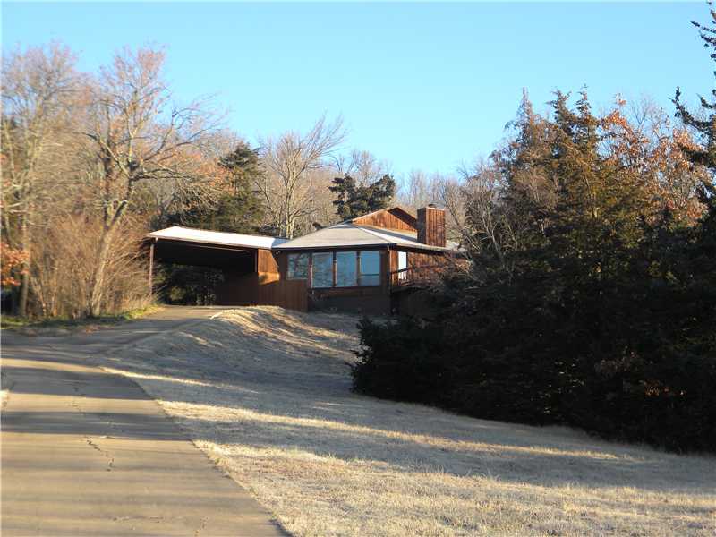 Sit on your oversize deck/Living Room/Kitchen/ or Bedroom and enjoy the views. Contemporary home on one level. 1000 sq ft detached shop is ideal for hobbies/workshop. New septic system.,Home is in Fayetteville School zone.