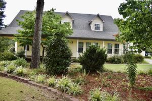 If a pool, shop, guest house/pool house, hot tub, and acreage are on your ''must have list,'' this 3,900 square foot home located close to the Russellville Country Club is the one for you! The exterior features a timeless traditional design and a back porch perfect for entertaining. The pool house has a full bath, kitchen, and living room. The main home has four bedrooms a bonus room/5th bedroom that would also be a great office or playroom. The 40x30 shop with three bay doors is massive with an additional area upstairs for storage. This beautiful home literally has everything you could ever need and want!