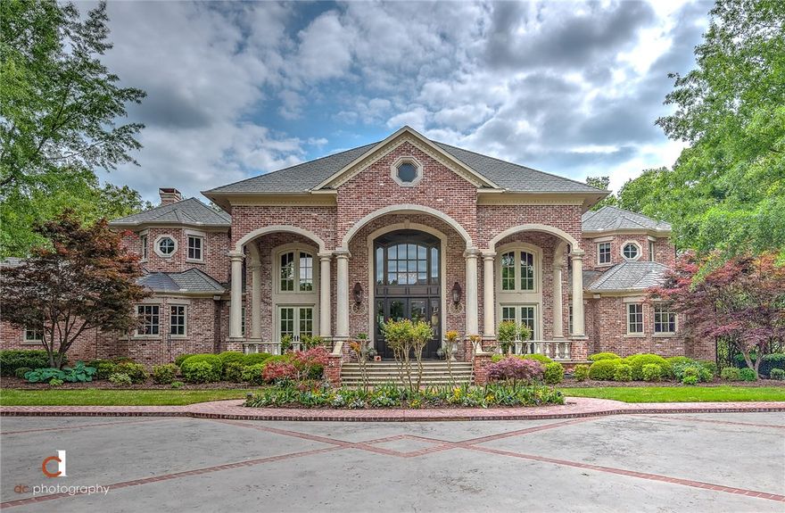 REMARKABLE EUROPEAN-STYLE ESTATE LOCATED IN ONE OF FAYETTEVILLE’S MOST EXCLUSIVE GATED COMMUNITIES. INCOMPARABLE IN STYLE & DESIGN, THIS EXCEPTIONAL 3 LEVEL RESIDENCE SITS ATOP A 2.34 ACRE SETTING OVERLOOKING THE CITY SKYLINE AND BOASTS AN ENDLESS LIST OF AMENITIES!!  Grand double staircase, marble flooring, antique brick exterior, hand-scraped wood flooring, chef’s kitchen, custom millwork, 2-story windows, wine cellar, 2-story library, fully equipped media room, gym, sauna, craft room, formal dining and spectacular walk-in storage space!  Main level luxury master retreat w/ sitting room & marble bath!