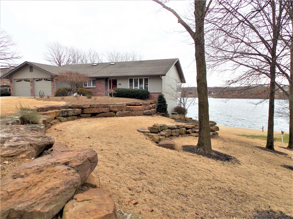 Loch Lomond lake front with 180 ft. of shore line. Boat house with lift, easy walk, low to water. View the Fire Works from your Decks. Master Bath & kitchen remodeled, new bay windows, sunroom new carpet and windows and slider door. New ceilings in lower level, floor in garage painted, new irrigation system installed.House painted exterior, gutter guards were added, extensive yard work has been done. Sea wall redone 2 years ago. The view of the lake is Spectacular!!!!!!