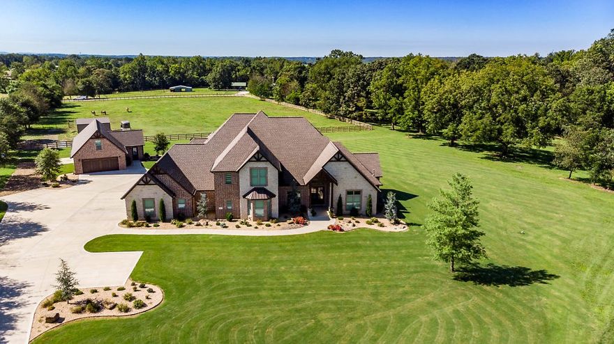Parade of Homes Award-Winning Estate on 5 Acres!    Tall Oaks Construction Custom-Built and 2017 Best Overall Winning Design (Floor Plan, Kitchen, Master Suite)  Featuring over 6372 Sfeet, 5BR, 6.5Baths, this home is an Entertainer's Dream with an exceptional open flowing floorplan with Chef's Kitchen featuring 12 foot island, Thermador/Bosch Appliances, Custom Cabinets, Quartz Counters, Designer Lighting.   Huge Master Suite with Wet-Bar/Wine Cooler, Luxurious Master Bath with Custom Tile and Heated Floors.  Game Room with Wet-Bar on main level,  Mother-in-Law Suite, Office, Outdoor Kitchen and Covered Entertaining Area overlooking private serene setting. Detached 1700 Sfoot Garage and Pole Barn.  Fantastic Bentonville location!  A complete list of amenities upon request.