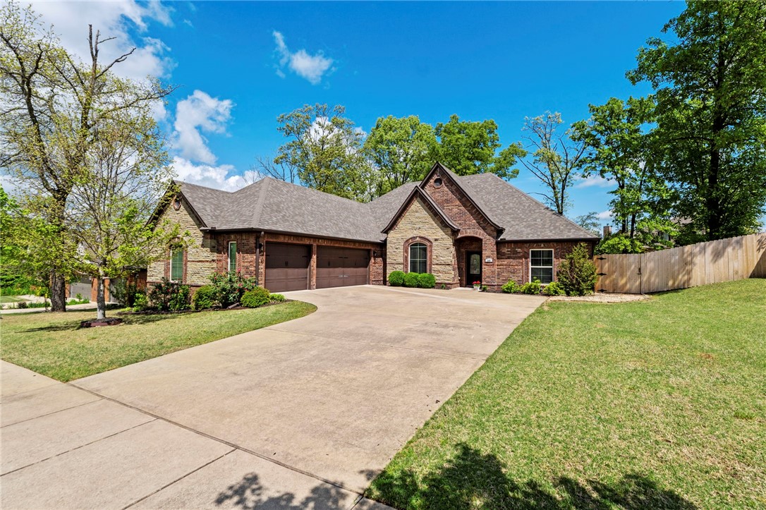 THIS is your next home! With direct access to mountain bike trails at the entrance of the neighborhood, this 4 bed, 3 bath is PERFECT for that lifestyle that Bentonville is known for. Close proximity to Downtown, this home features granite countertops throughout, hardwood floors, & a spacious living room with a cozy gas fireplace. The kitchen includes both a formal dining room & a breakfast nook. The large master suite offers a jacuzzi tub, walk-in tiled shower, & a generous sized walk-in closet. Step outside to an oversized covered patio with an extended concrete area, all overlooking a large, private backyard, ideal for relaxing or hosting guests. Don’t miss this move-in ready gem close to schools, parks, & all that Downtown Bentonville has to offer! New paint throughout, new wood flooring into bedrooms, New Roof.