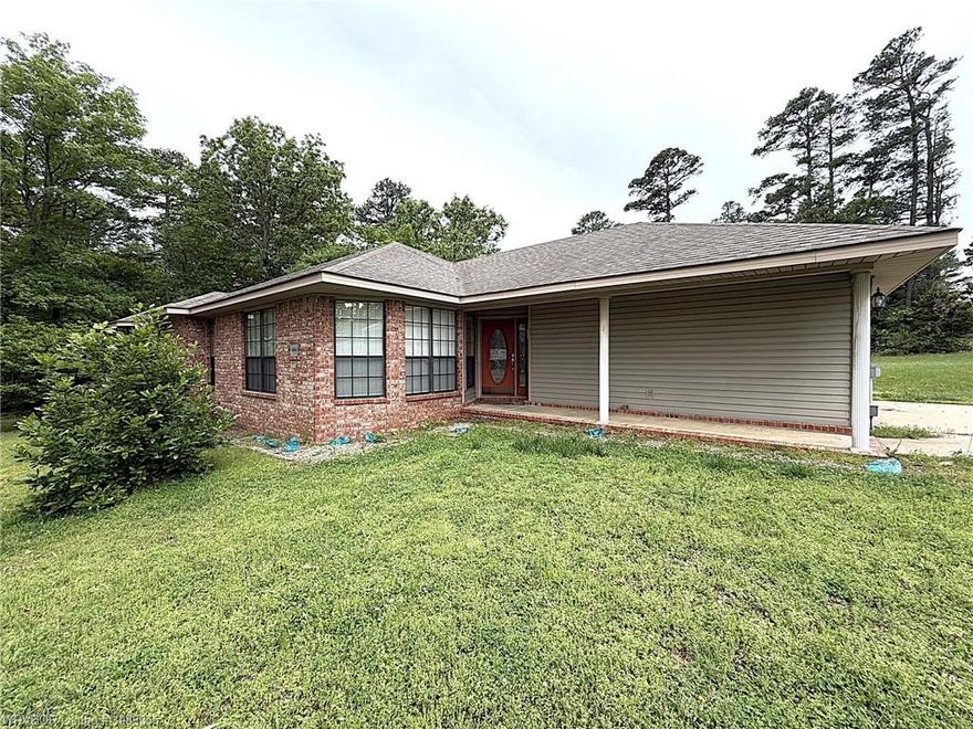 Outdoor enthusiasts take notice! This 1860 sqft brick home sits on just over one acre and adjoins national forest on two sides. Walking distance to Devil's Canyon trailhead and less than a 10 minute drive to Shores Lake! The house is in immaculate condition and features a wood pellet stove, propane log fireplace, and a large kitchen with built in pantry. Master suite has a tile shower and spacious walk-in closet. Fiber internet, rural water (plus a well for watering) and paved highway frontage. The metal barn has four different bays for your storage needs. This property would make a great nightly rental, hunting getaway or just a peaceful place to call home! Most of the furnishings will convey, see agent for details.