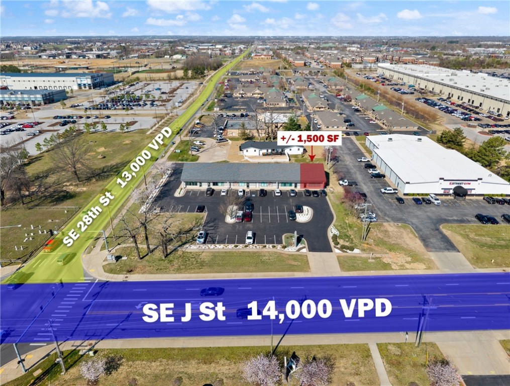 This +/- 1,500 SF office space is now available in Bentonville, offering a prime location and functional layout for any business. This space includes six private offices, a private restroom, a conference room with a kitchenette, and a welcoming area, providing both convenience and comfort. Positioned at the highly visible corner of SE J St (14,000 VPD) and SE 28th St (13,000 VPD), the property is just two minutes from SE Walton Blvd, less than five minutes from the new Walmart HQ, and only 10 minutes from Downtown Bentonville. For those needing additional space, this suite can be combined with Suite 4 next door, increasing the total available space by an additional +/- 1,500 SF.