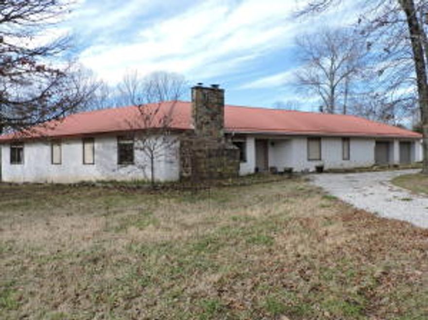 693 acre Ozark Mountain Showplace Farm! Located near the Buffalo River National Park and only 1 hour from Fayetteville and Northwest Arkansas. Spacious home with approximately 3674 sq ft. big rooms including a living room and dining room combo with fireplace. Den with fireplace insert. The kitchen as an island, pantry, is fully equipped and has a fabulous view! Huge master suite with jacuzzi tub and shower and 2 walk-in closets. A rec room could easily be a 4th bedroom and it is plumbed for a 1/2 bath. Nice office. The home has 18'' thick walls, a metal roof, a double garage, cedar lined closets, 2 central heat and air units and a big utility room. 60-80 acres of prime bottom land hay fields! 5 ponds, some stocked with fish. Property borders Osage Creek.