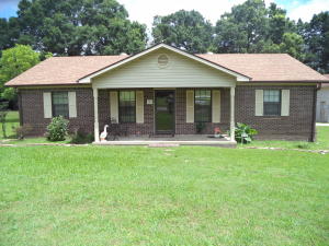 Neat home on more than 1 acre in Atkins. Large workshop and storage building. Convenient to shopping.3BR 2BA with hardwood floors.1380 Sq Ft.