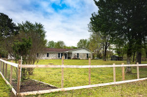Come see this updated family home with a country setting!! Beautiful 3bd/2 bath home on 1.87 acres. Lots of updates including a new kitchen, new paint, inside and outside, new blinds, new vinyl plank flooring and new fixtures throughout the house. The home features 2 living areas, with a fireplace in the den. The coffee bar is an added feature that you will be sure to enjoy. You will love the nice enclosed sunroom/patio, which will be the perfect place to enjoy that morning cup of coffee. To top it off, the fenced back yard will be the perfect for your cherished fur babies. An additional 3 acres can be purchased with the property.