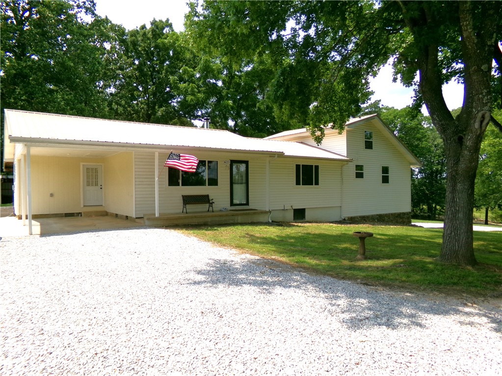 Welcome home!! This beautifully remodeled 3-bedroom, 2 bath residence perfectly combines modern comfort with serene country living. Nestled on over 1 acre of land, the property offers the space and privacy you've been looking for-with plenty of room to roam, garden, or even add a workshop. Inside you'll find a thoughtfully updated interior featuring an open-concept layout with stylish finishes. The home features beautifully crafted, custom-made cabinets throughout that offer country charm and ample storage! The beautiful landscaped yard consist of blackberry bushes, peach, pear and pecan trees! This turnkey home is ready for you to move in and make it your own!! Schedule your private tour today!!