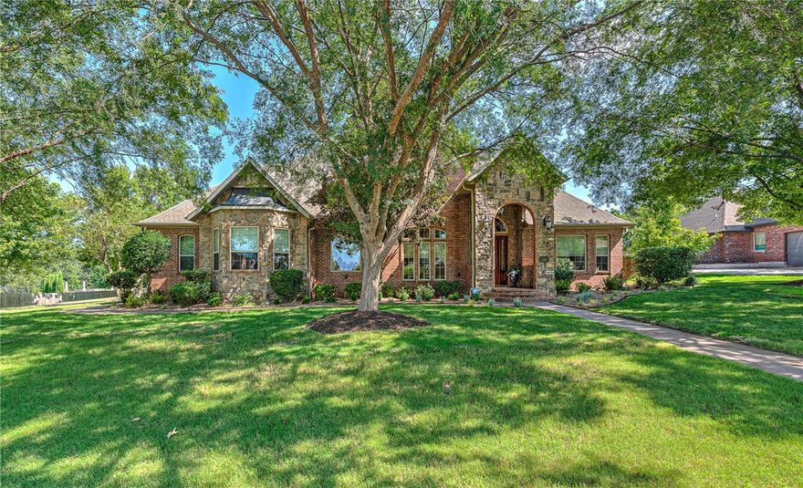 Nestled in the desirable Ridgewood Subdivision of Cave Springs, this extraordinary 4,350 SF executive home offers captivating curb appeal, 4 BRs, 3.5 BAs, and impeccable craftsmanship. A grand covered front porch opens to soaring ceilings and newly refinished hardwood floors. To the right is a library, and to the left is a formal dining room. The expansive family room flows into a gourmet kitchen with high-end finishes and a charming eat-in area. The main-level primary suite includes a cozy sitting area and an en suite bath w/Jacuzzi, walk-in shower, dual vanities, and a pair of walk-in closets. Upstairs offers 3 spacious BRs, 2 full BAs, and a media room perfect for entertaining. The backyard is an oasis, featuring a covered patio, hot tub, gazebo, and peaceful views of nature. Additional features include a large walk-in pantry, sizeable laundry room with built-in storage, and an office nook tucked beneath the stairs. Rare opportunity in a highly sought-after neighborhood. Schedule your private showing today!