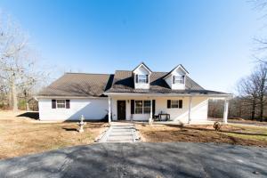 Nice larger home boasting huge kitchen/dining area with an abundance of cabinets and granite countertops; beautiful hardwood floors in Living Room; all bedrooms are large for that growing family; workshop area in basement; additional detached garage/workshop plus partial RV carport; only 15 minutes to the lake; two fireplaces