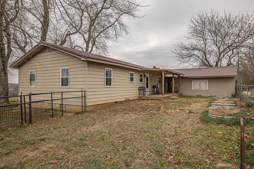 Cozy 1586 SF home on 40.66 acres with awesome views! The home sits well back off the road for privacy & seclusion. The home has had some nice updates! Newer bath vanity, kitchen countertops, painted cabinet doors, some new flooring, etc. Two living spaces. Den has a wood buring insert to keep the house warm & cozy in the winter months. Durable metal roof. The home sits atop a hill with a nice summer breeze to keep it cooler in the summer months. Expansive views!!! Detached shop (approx 1400 SF) with power (including 220volt). Established garden and some raised beds as well! Chicken coup. Nice spring-fed stocked pond. Plenty of pasture for some cows, horses, or goats! Old homestead has a hand-dug well that possibly could be put back into operation for irrigation. Great hunting. Quite & peaceful setting. High-speed fiber optic internet. Serene waterfall below the pond. This property has it all! A great place to call home!