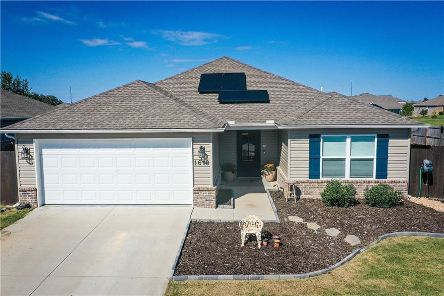 Step inside and imagine coming home to this beautifully upgraded home filled with thoughtful details and energy-efficient features. Enjoy spacious 9-ft ceilings, granite countertops throughout, and a kitchen with upgraded appliances. The living spaces feel bright and inviting with blinds, curtains, and window shades. Outside, relax under the cedar pergola or tend to your garden in the fenced-off area with raised planters. The full wooden privacy fence with dual gates offers plenty of access to your large space to unwind. Additional highlights include upgraded insulation in all walls and attic, a fully insulated garage, and HVAC rigid duct upgrade for comfort and efficiency. Solar panels help keep your monthly bills low! Located just 5 minutes from Bentonville West High School and a short walk to Cornerwoods Park with a new playground, pond, and bike trail. Schedule your showing today!