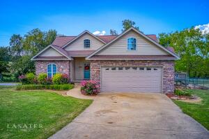 Don't miss out on this property with a Beautiful view and perfect location at the edge of town. This 4 bedroom/3 bath home sits on .74 acre fenced lot in a quiet subdivision. It is a must see with 9ft ceilings, arched doorways and crown molding throughout the house. Large windows provide lots of natural light. The oversized walk-in pantry and spacious laundry/mud room will not disappoint! With a finished walkout basement and safe room; this home provides a generous amount of storage. Call today and take a look! Square feet and rooms sizes are approximates.