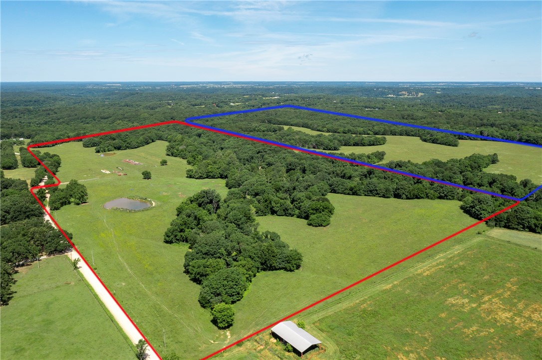 74.89 acres of nice pasture with wooded areas and two ponds and one stream; all year-round. Fenced on three sides (needs a fence between this parcel and the adjoining parcel). Electric available at street. This is wonderful property with nice views, open pasture, rolling pasture, and wooded areas. A good place for a home, to raise livestock, enjoy recreational vehicles, and hunt. Also, this property offers a great development opportunity.